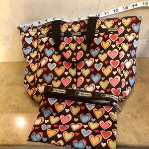 Le Sportsac medium heart tote with matching tote.